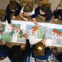 areal view of students creating a handmade art banner